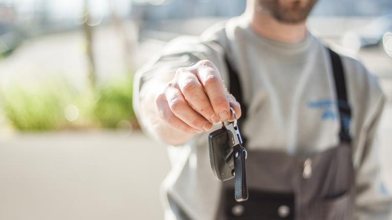 Man handing over car keys