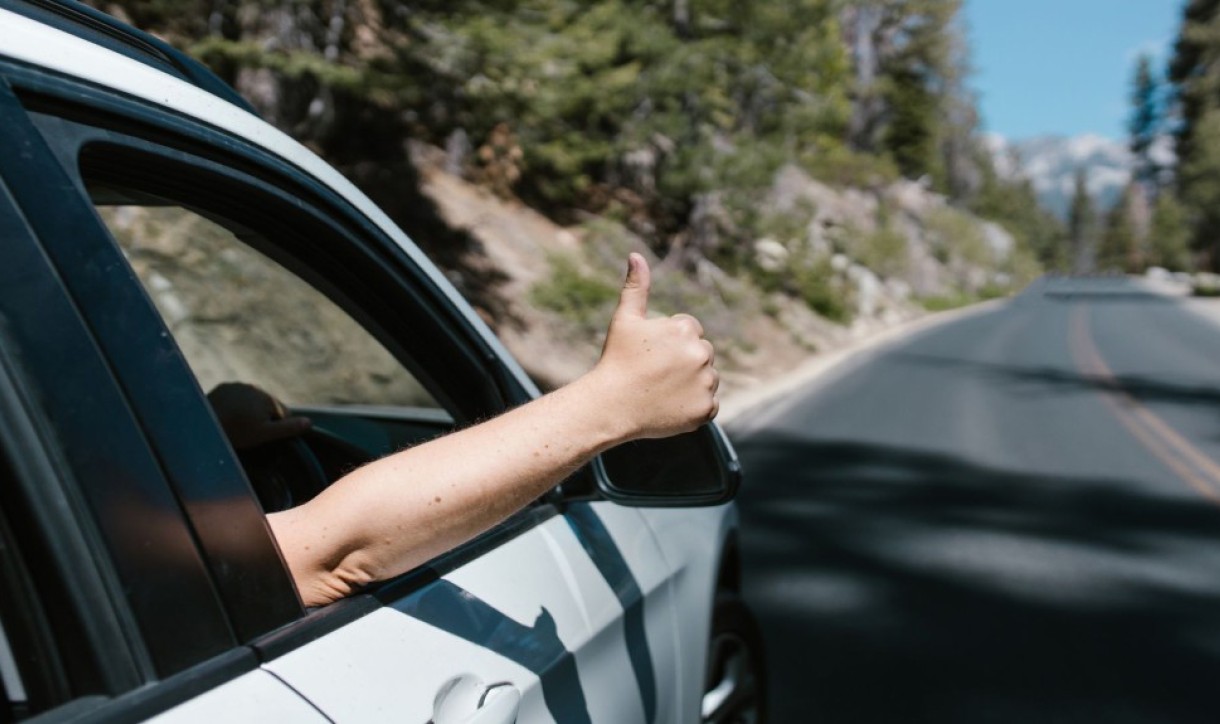 Thumbs up out car window