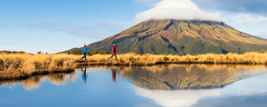 People walking by the mountain