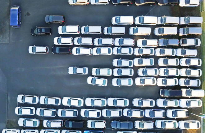 Aerial shot of a car park with parked cars