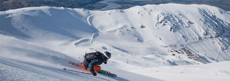 Action shot of person skiing down Mount Hutt